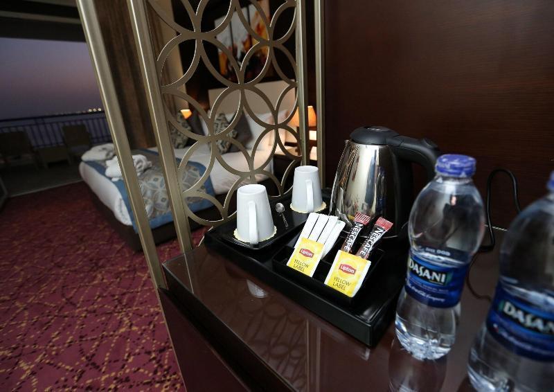 Tolip El Forsan Hotel Ismailia Exterior photo Bottled water in a hotel room